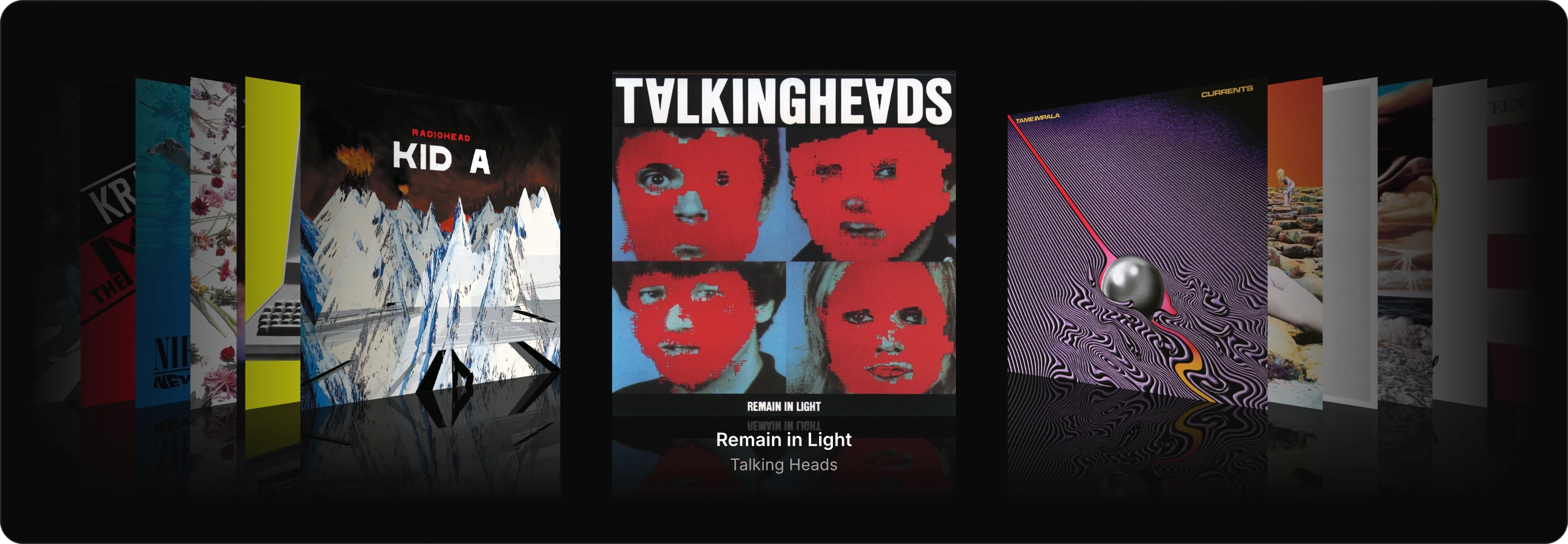 winyl.app on a Mac, in coverflow: Remain in Light by Talking Heads face on at the centre, Kid A and other covers turned away on either side, their reflections on the floor.